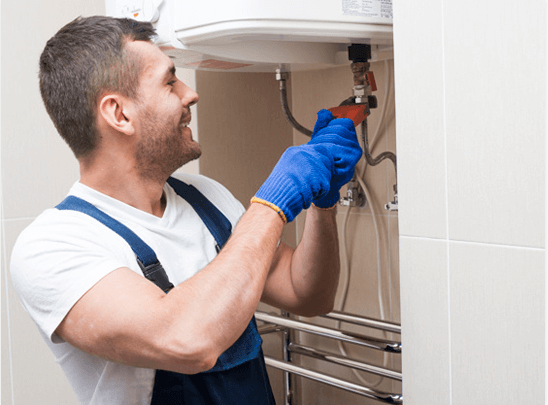 HVAC technician performing heating furnace repair and maintenance