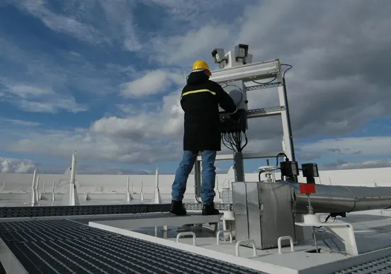 Rooftop HVAC System Maintenance – Riley Heat & Air HVAC Technician Performing Rooftop HVAC System Maintenance